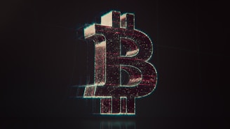 A shiny bitcoin logo on a black background