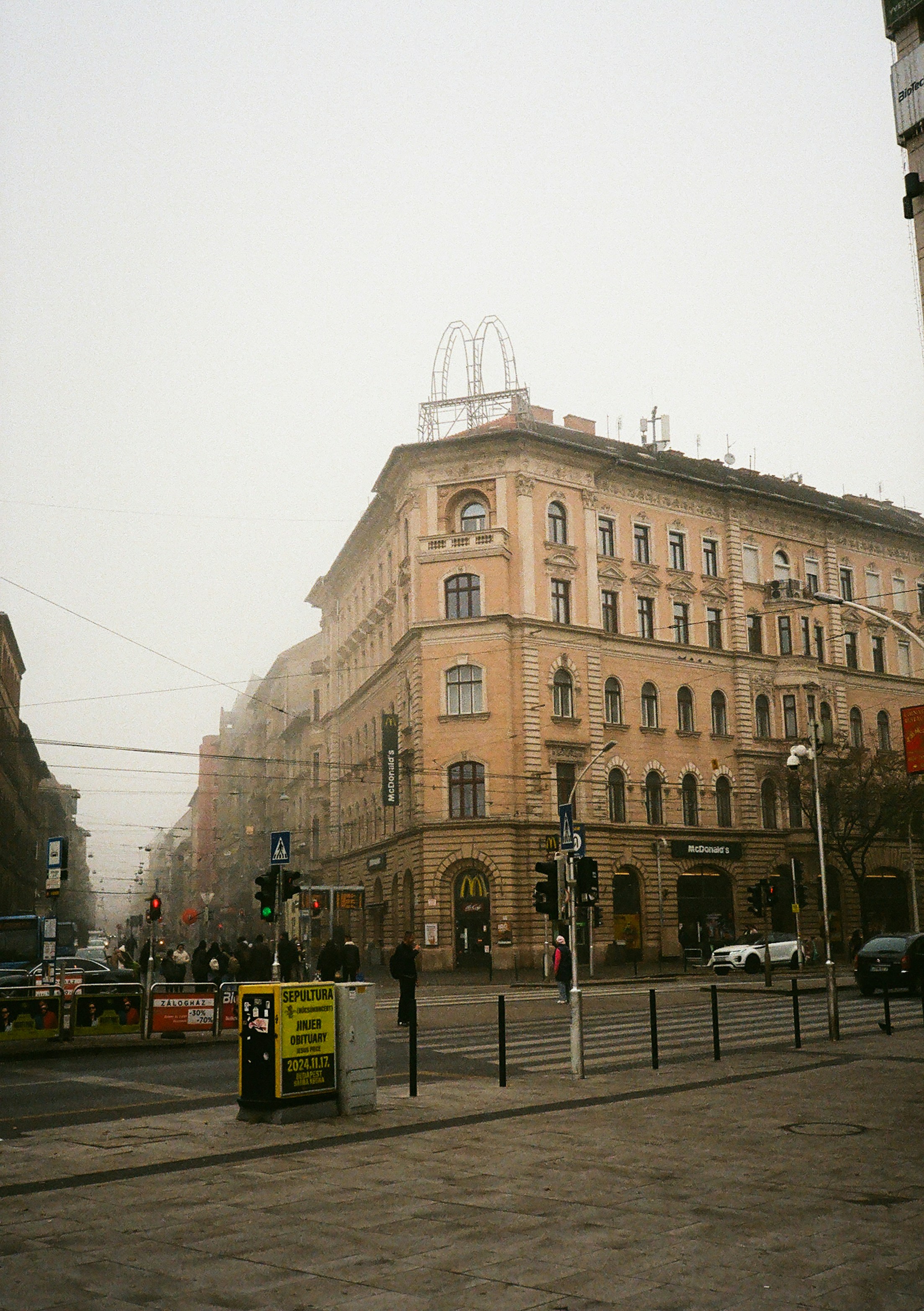 A street corner with a building in the background