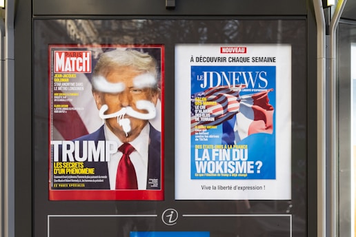 A newspaper dispenser on a city street
