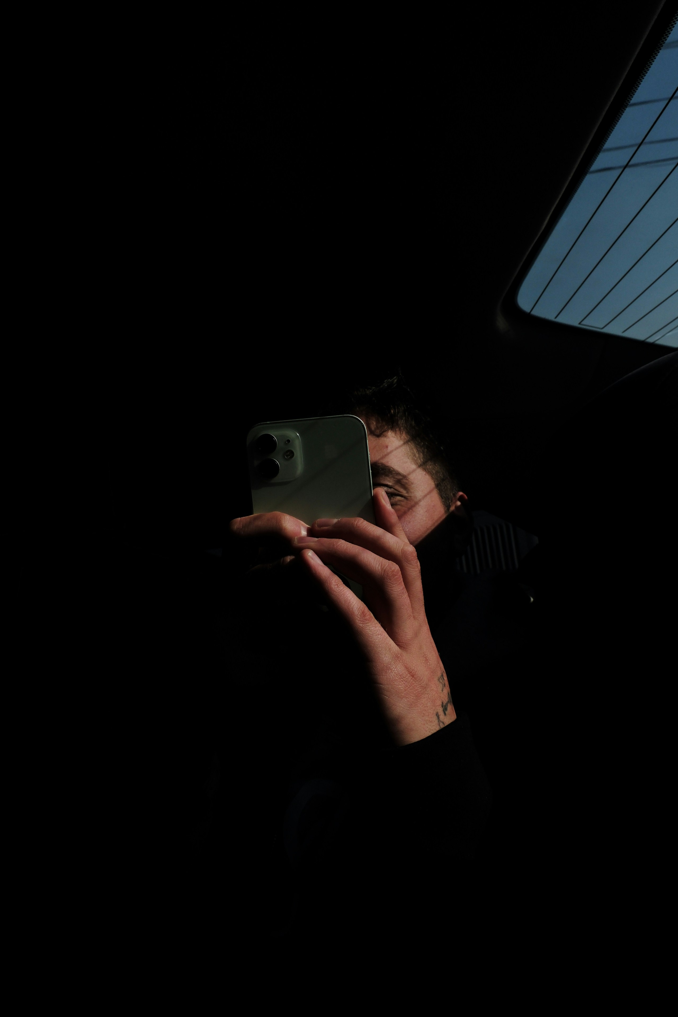 A man taking a picture of himself in the mirror