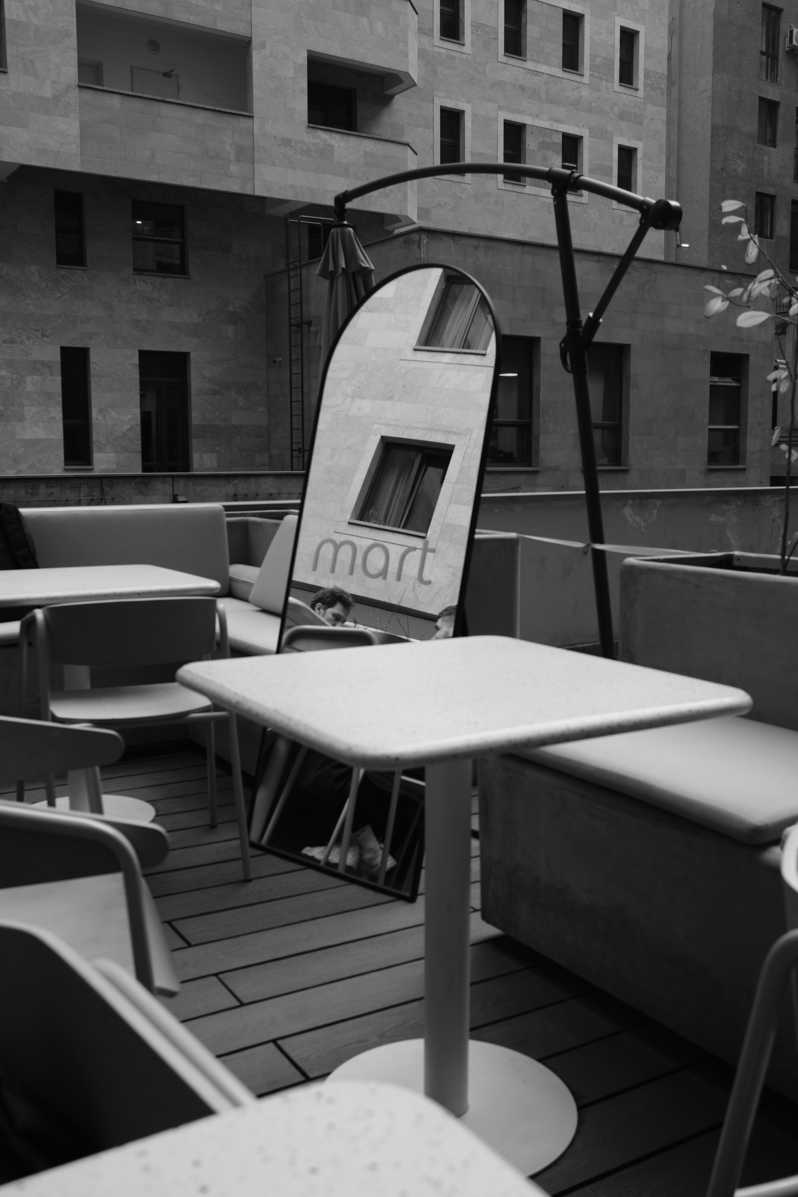 A black and white photo of tables and chairs