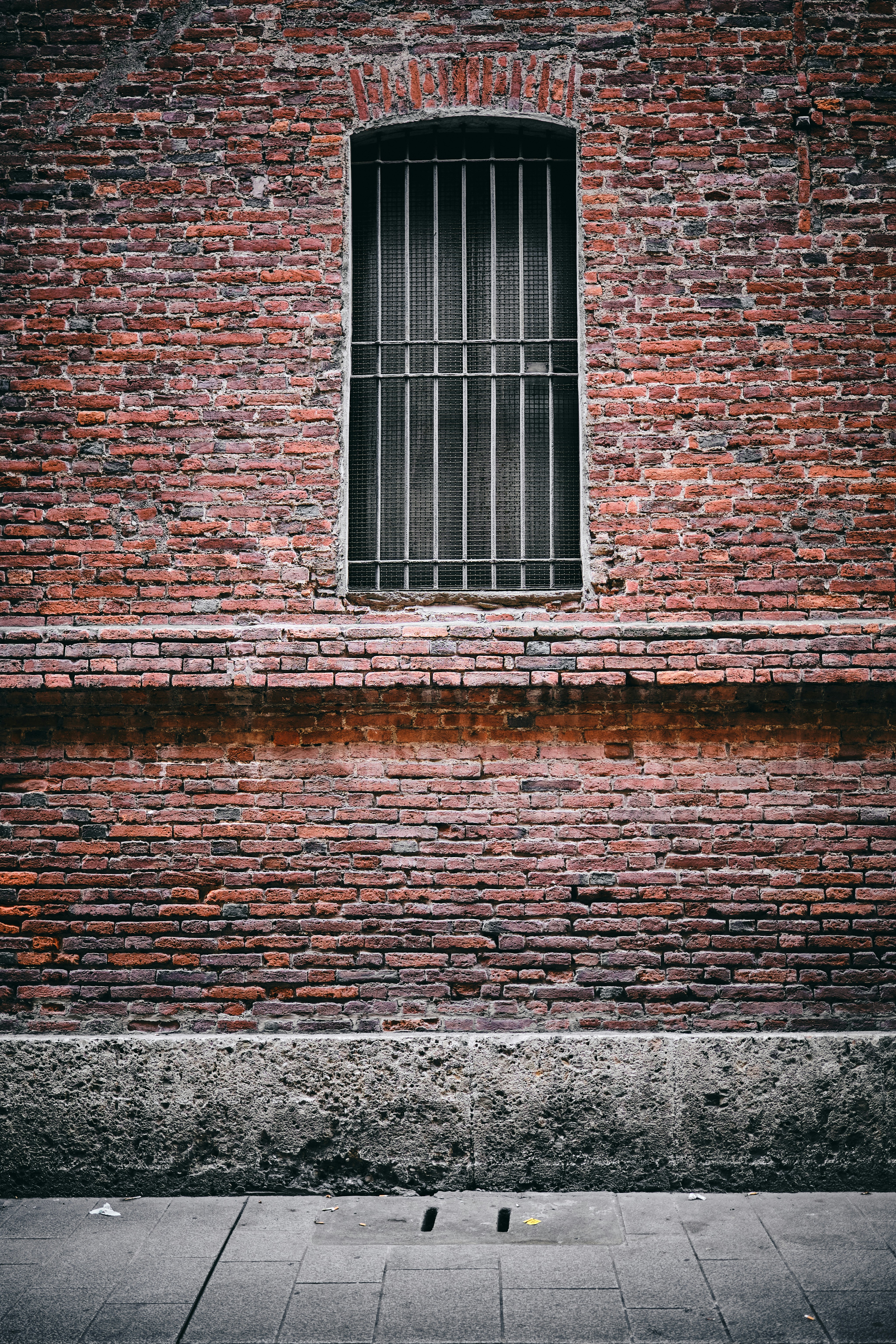 A white brick building with bars on the windows photo – Free Black Image on  Unsplash, image size:3000x4500