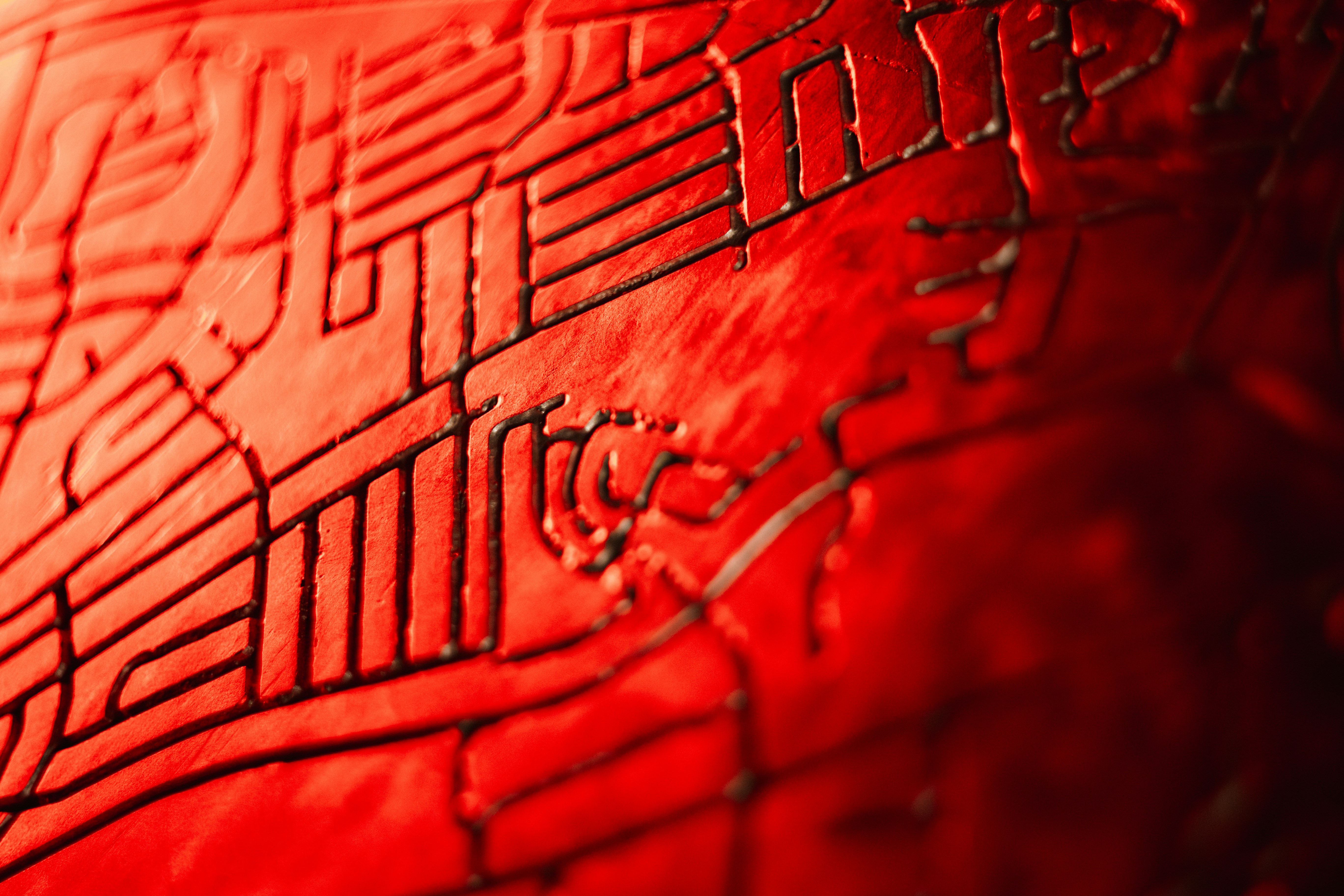 A close up of a red object with a pattern on it