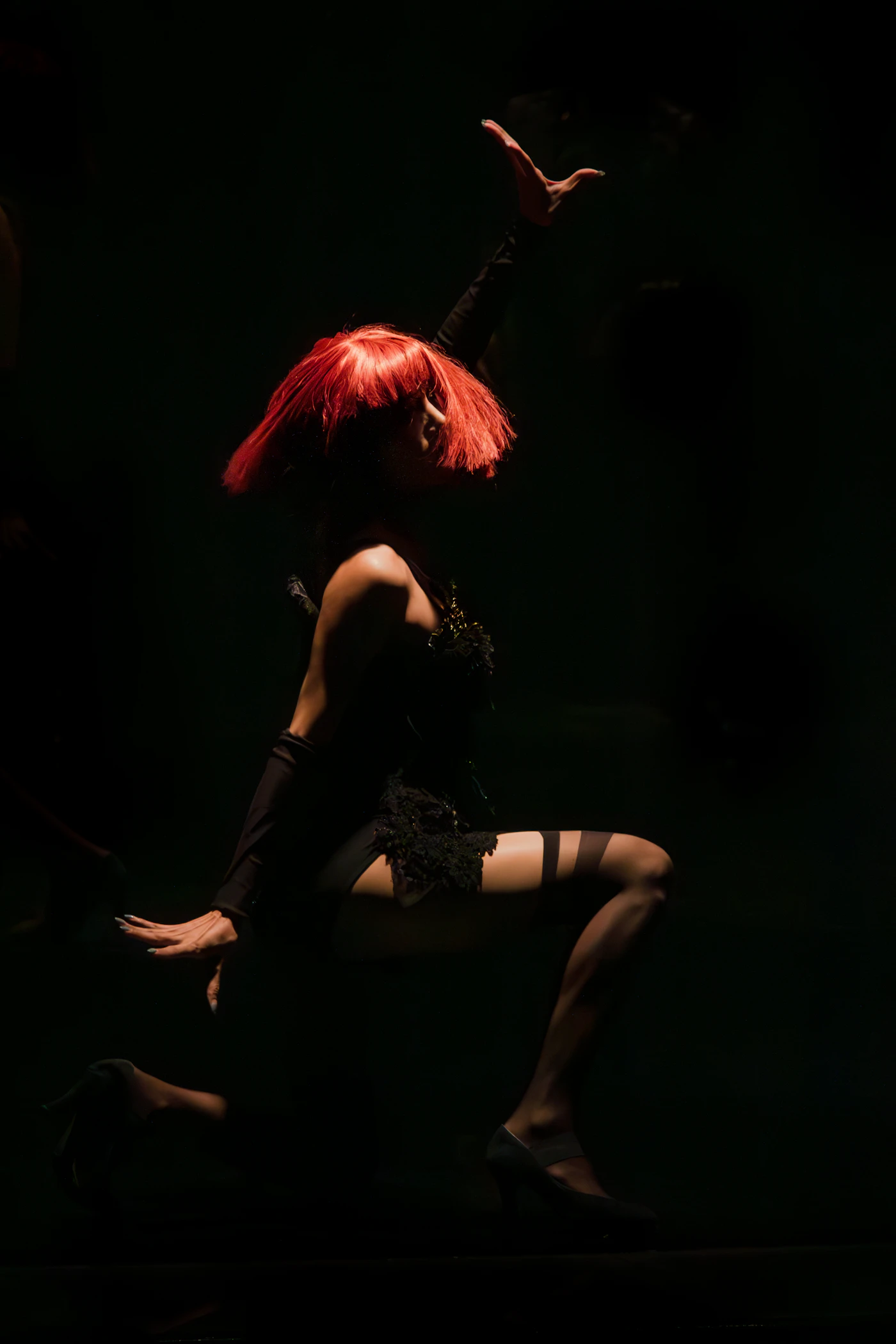 Female burlesque dancer performing in the spotlight