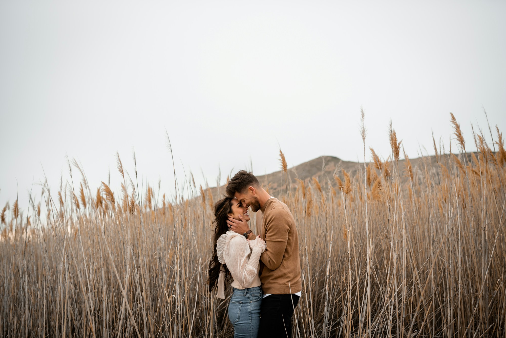 Couple in fall outfits outdoors