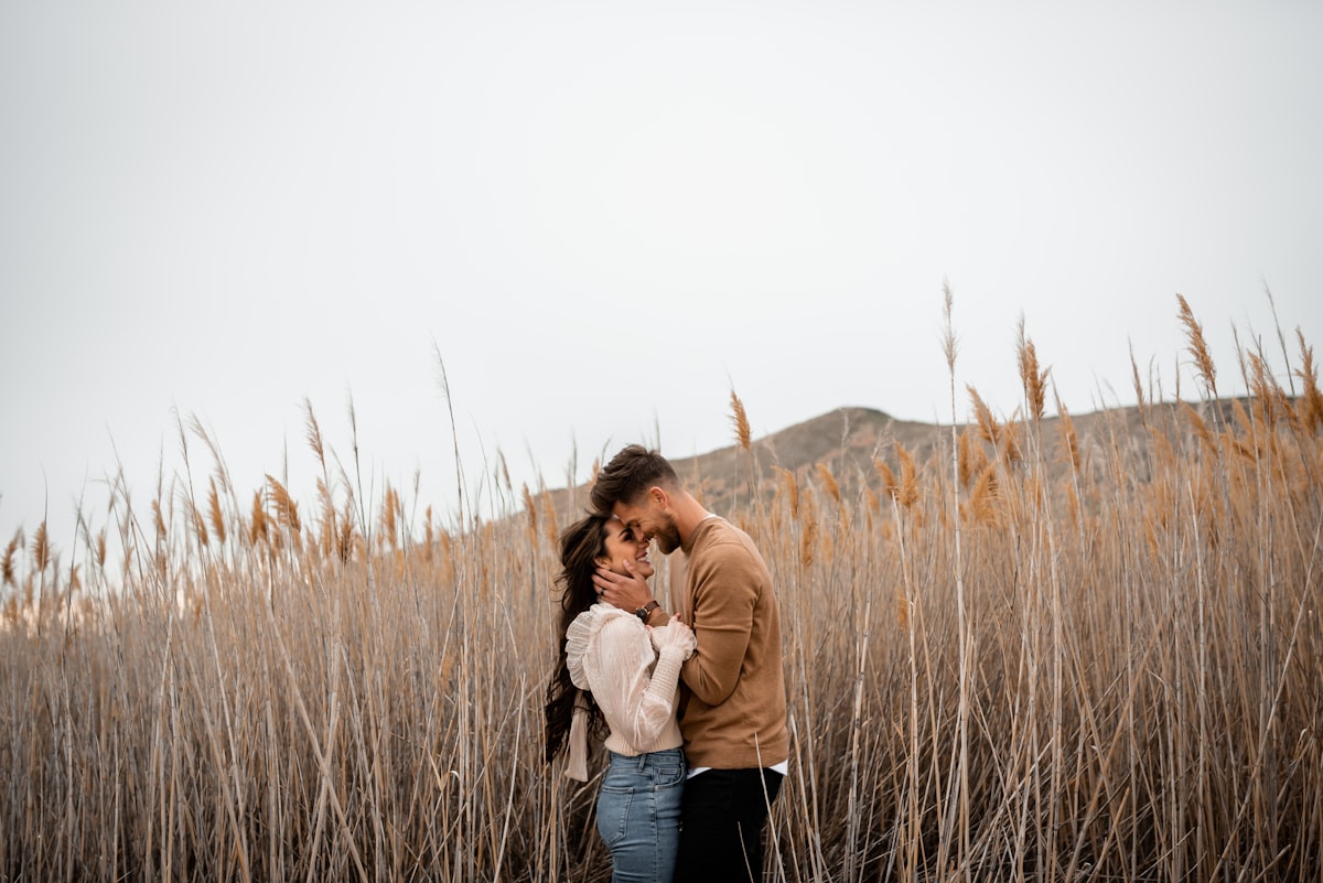 A loving married couple embracing outdoors