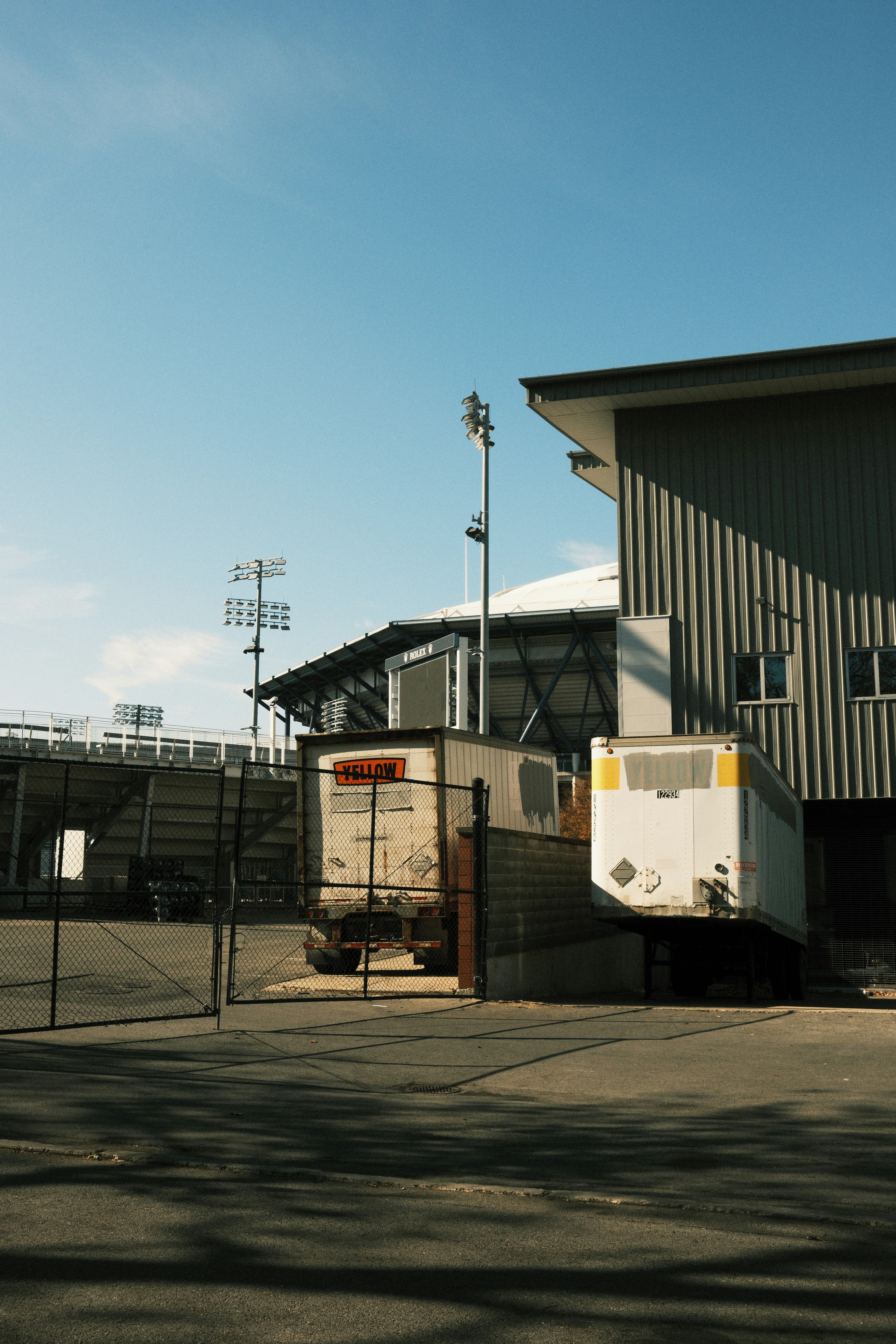 A large building with a fence around it