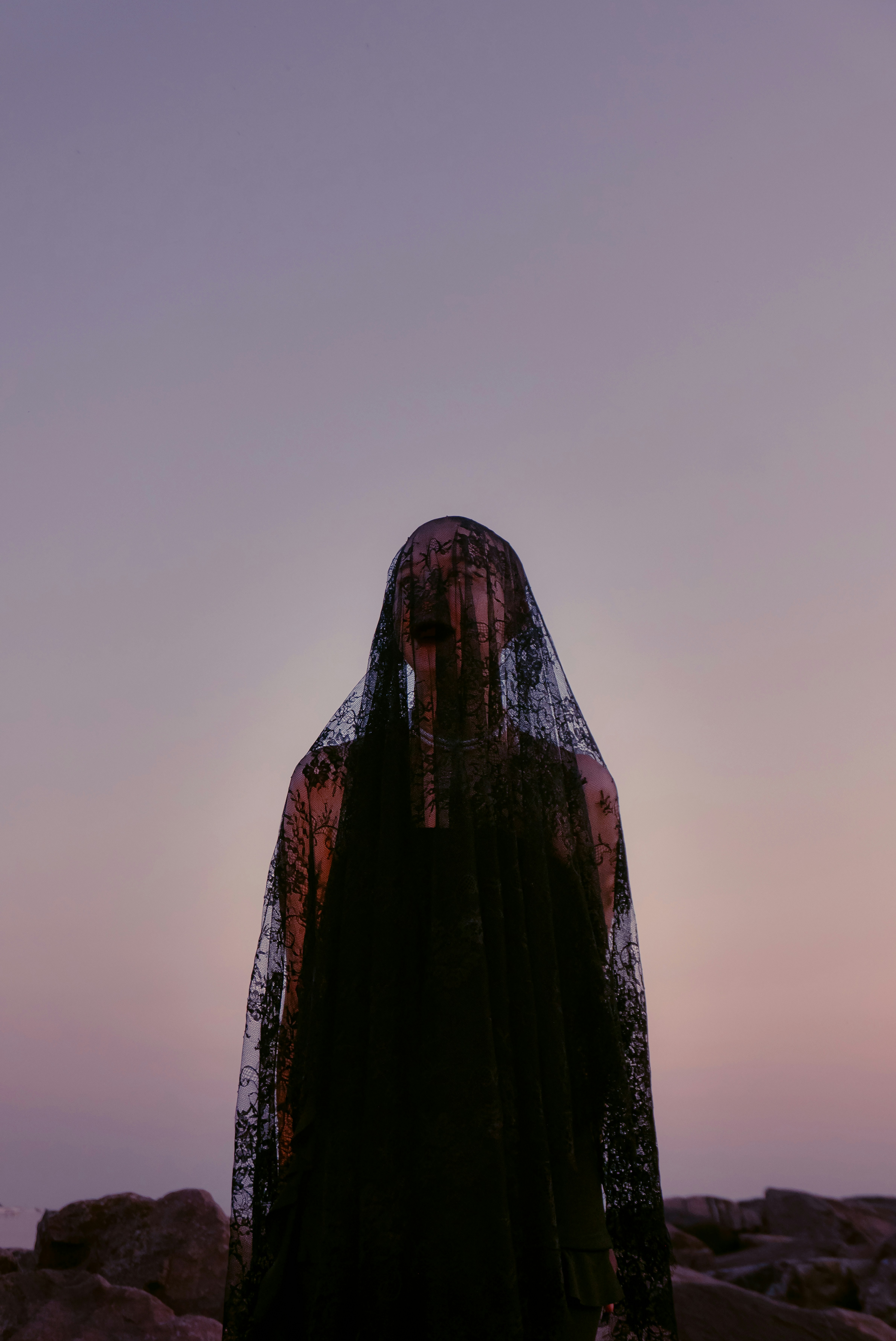 A woman in a veil standing on rocks photo – Free Fashion Image on Unsplash