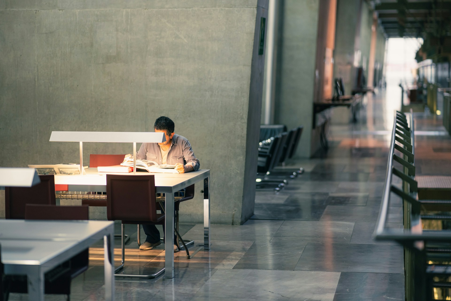 A person sitting at a table with a laptop