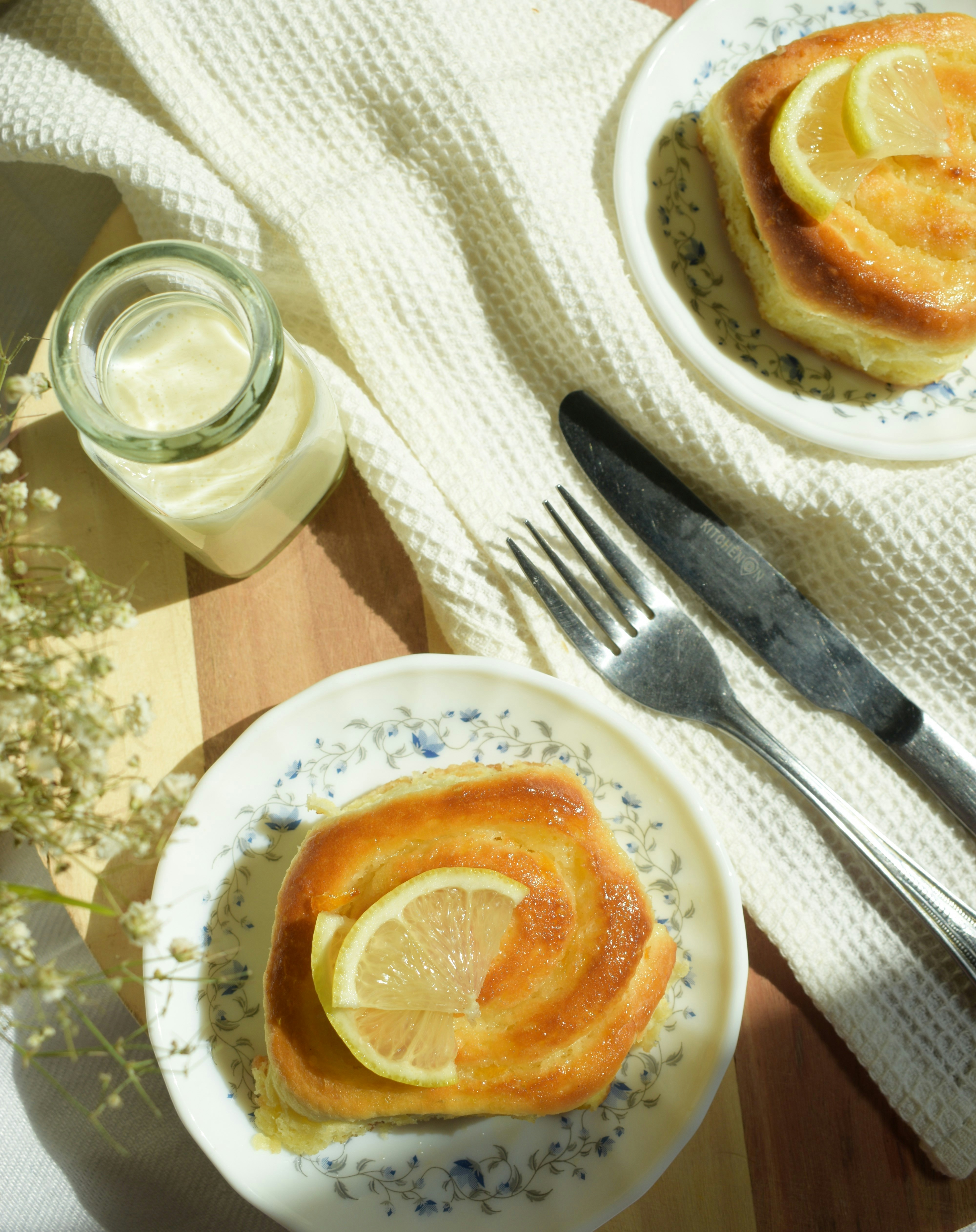 A table topped with plates of food and a glass of milk