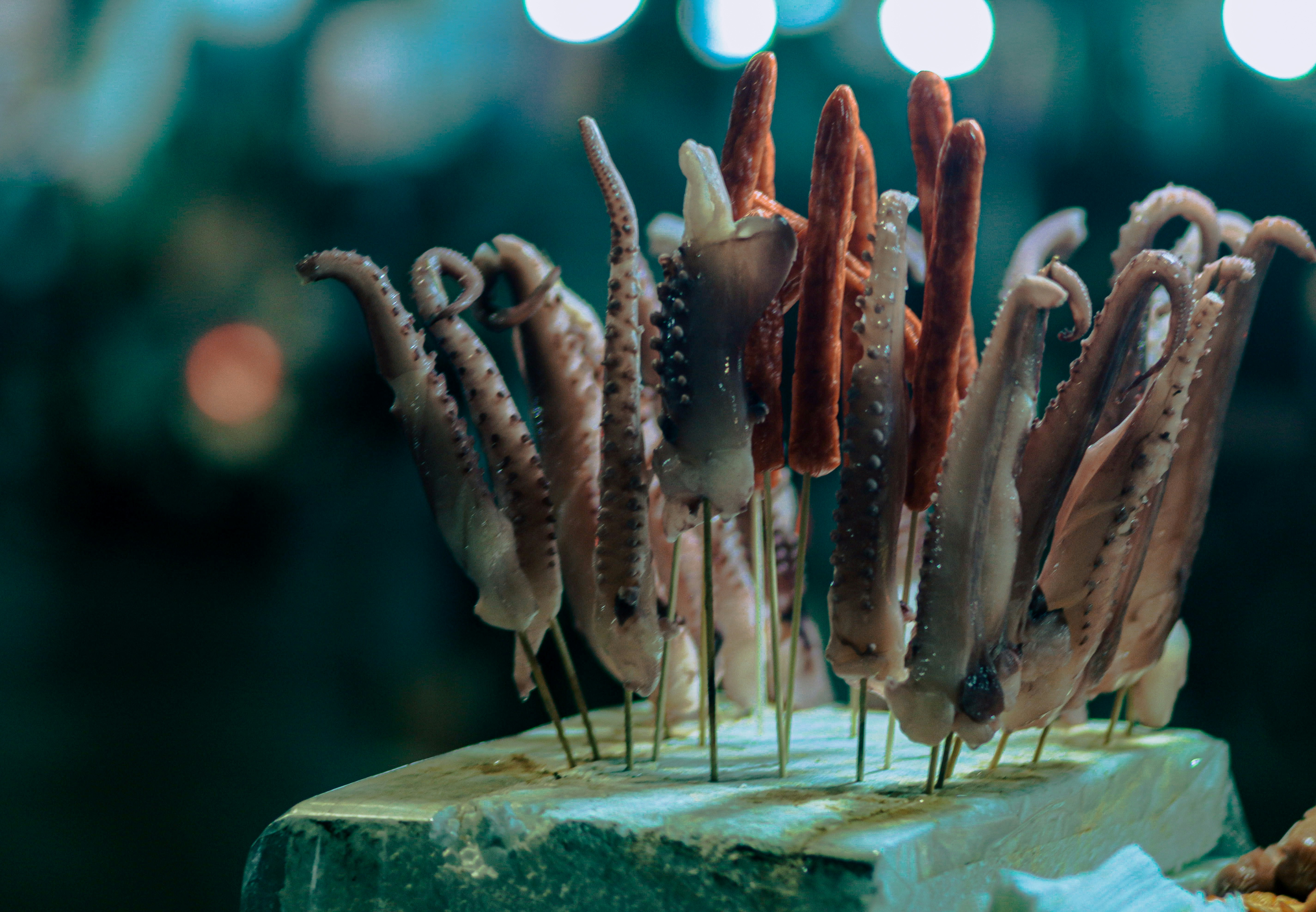 A close up of food on a stick on a table