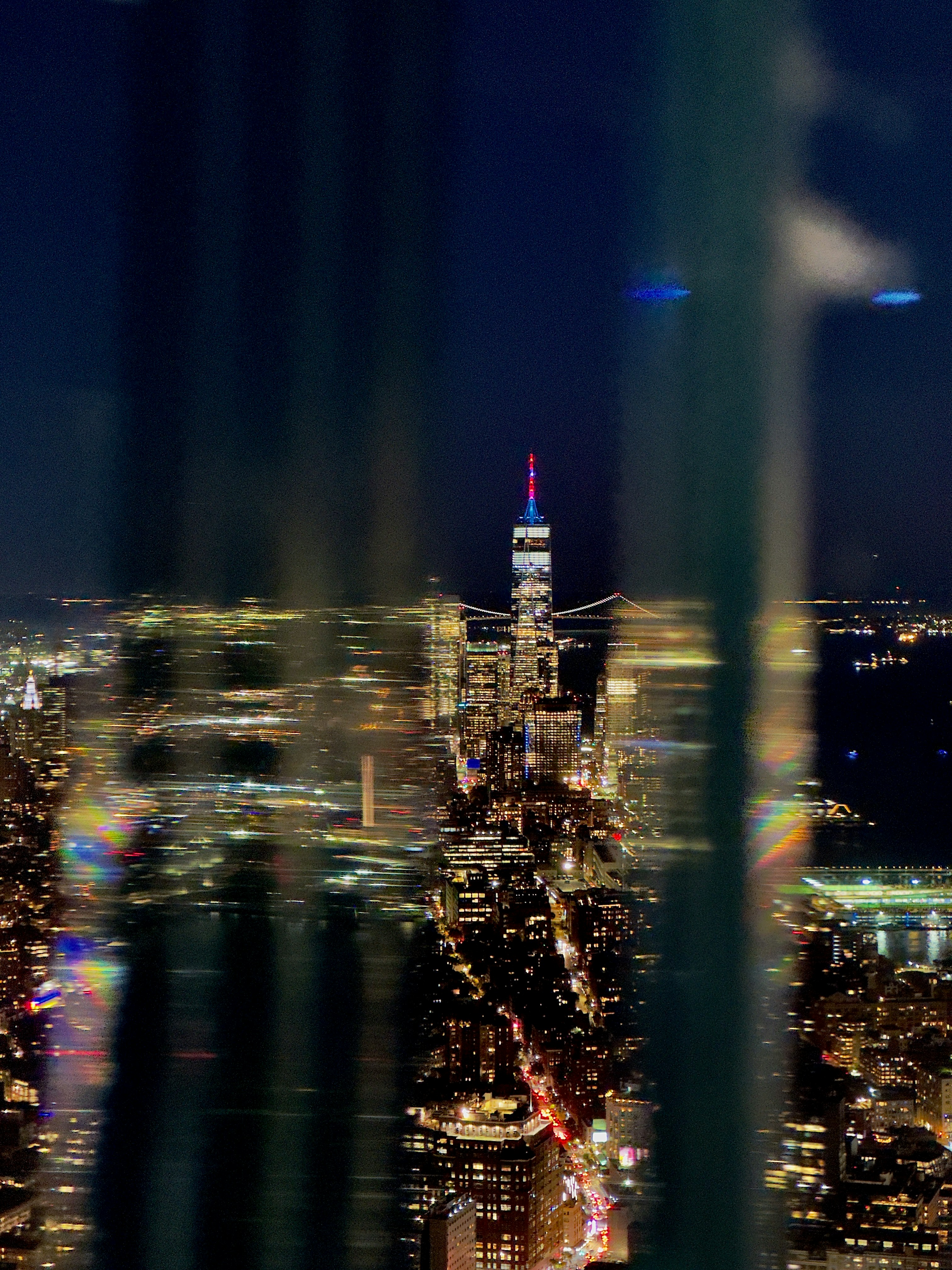 A view of a city at night from the top of a building