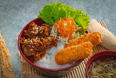 A close up of a bowl of food on a tabl