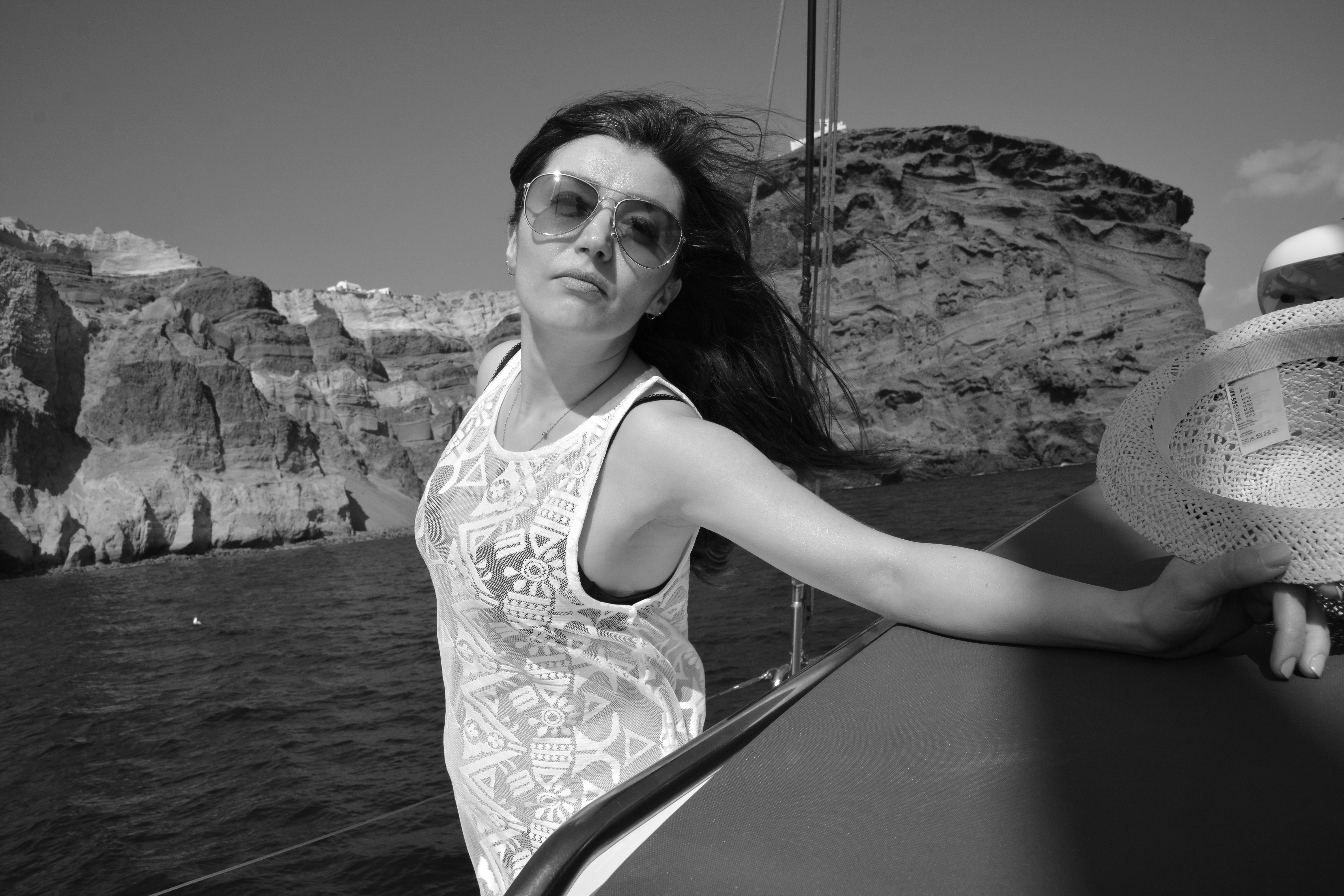 A woman standing on a boat in the water
