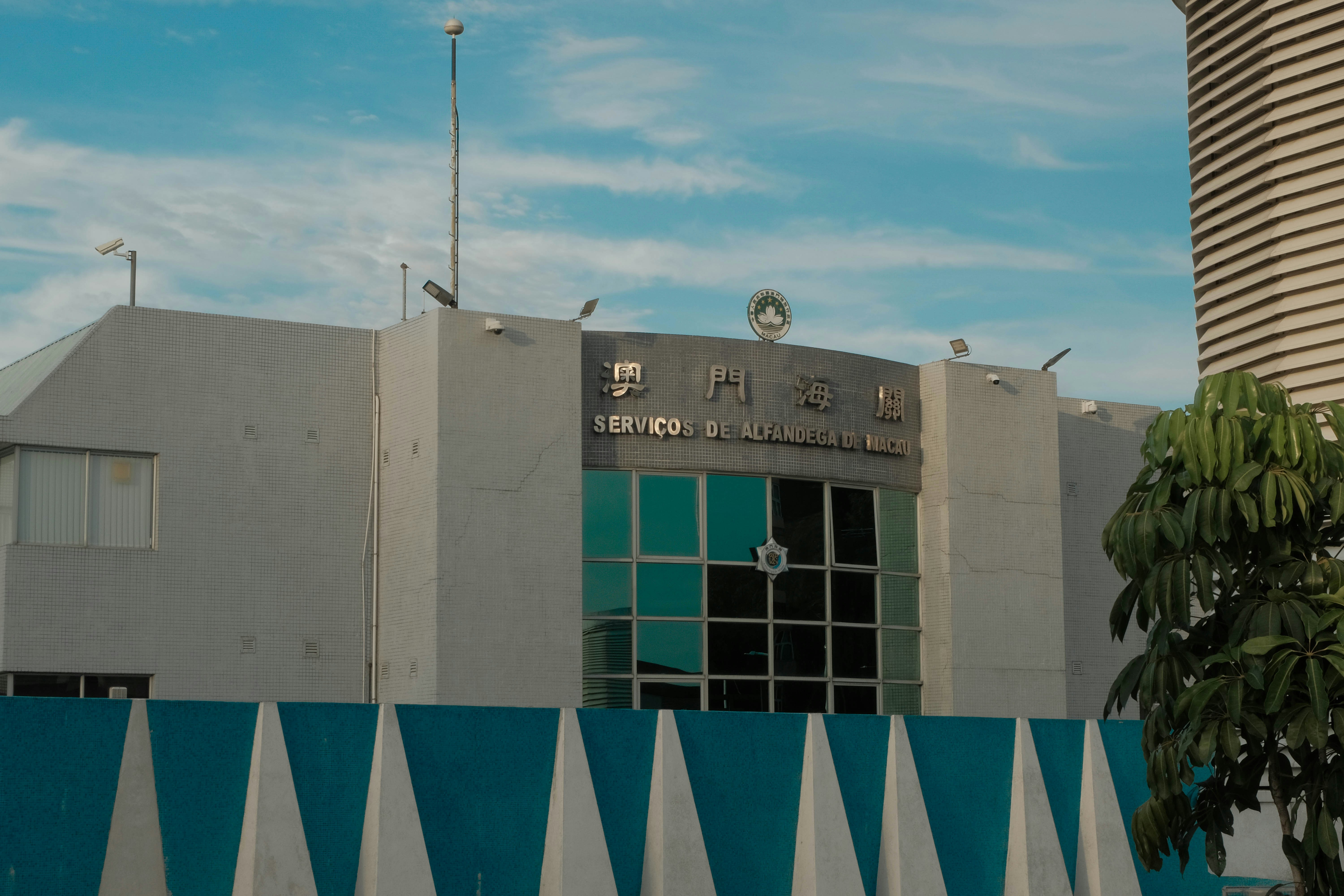 A tall building with a clock tower in the background