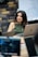 A woman sitting in front of a laptop computer