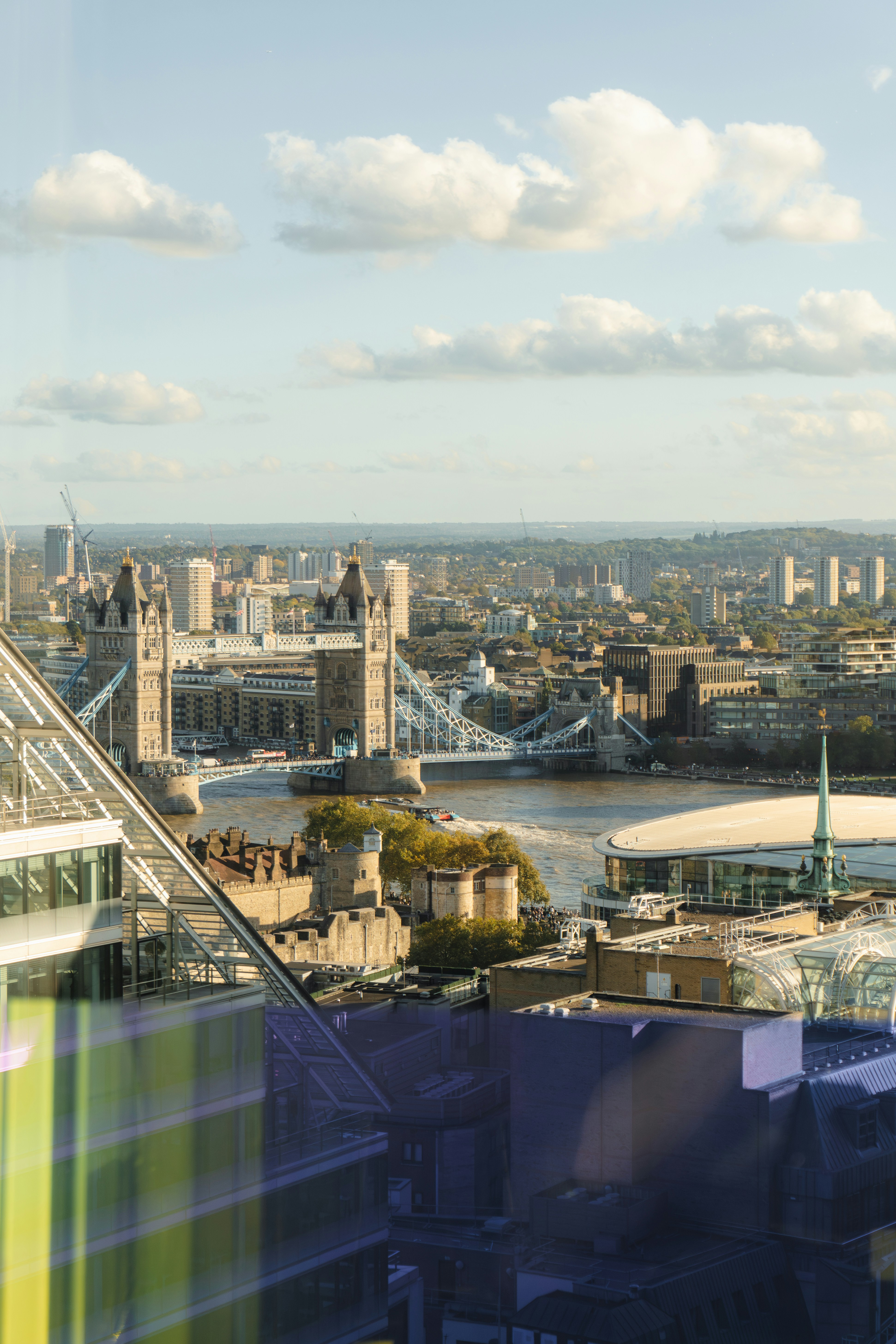 A view of the city of london from the top of a building