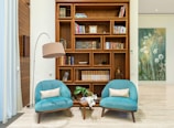 A living room filled with furniture and a book shelf