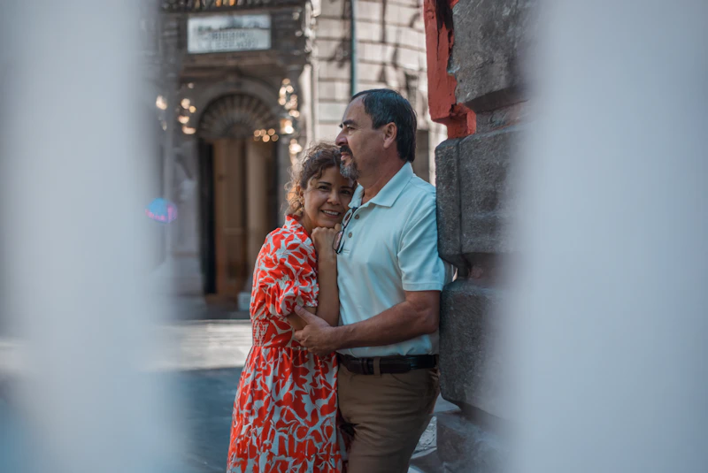 man and woman standing side by side smiling