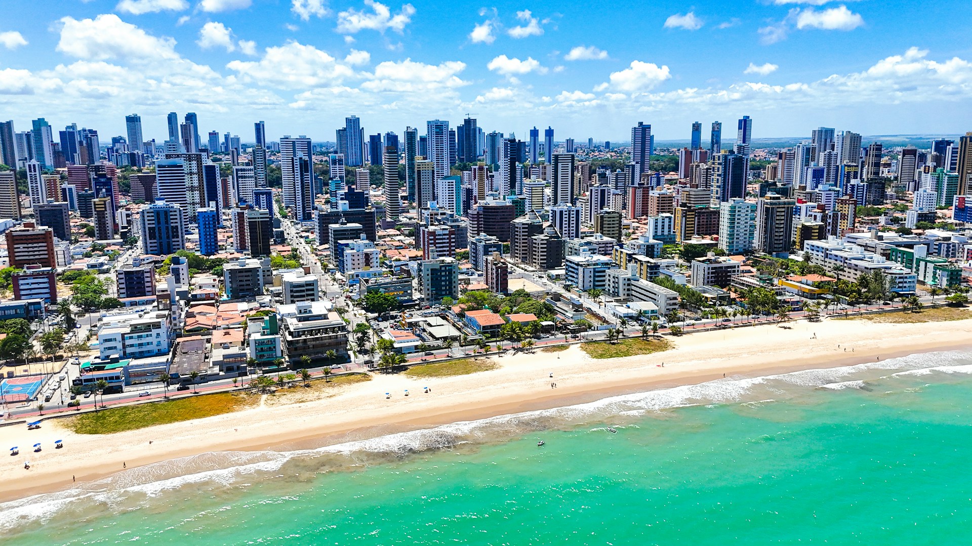 An aerial view of a city and the ocean