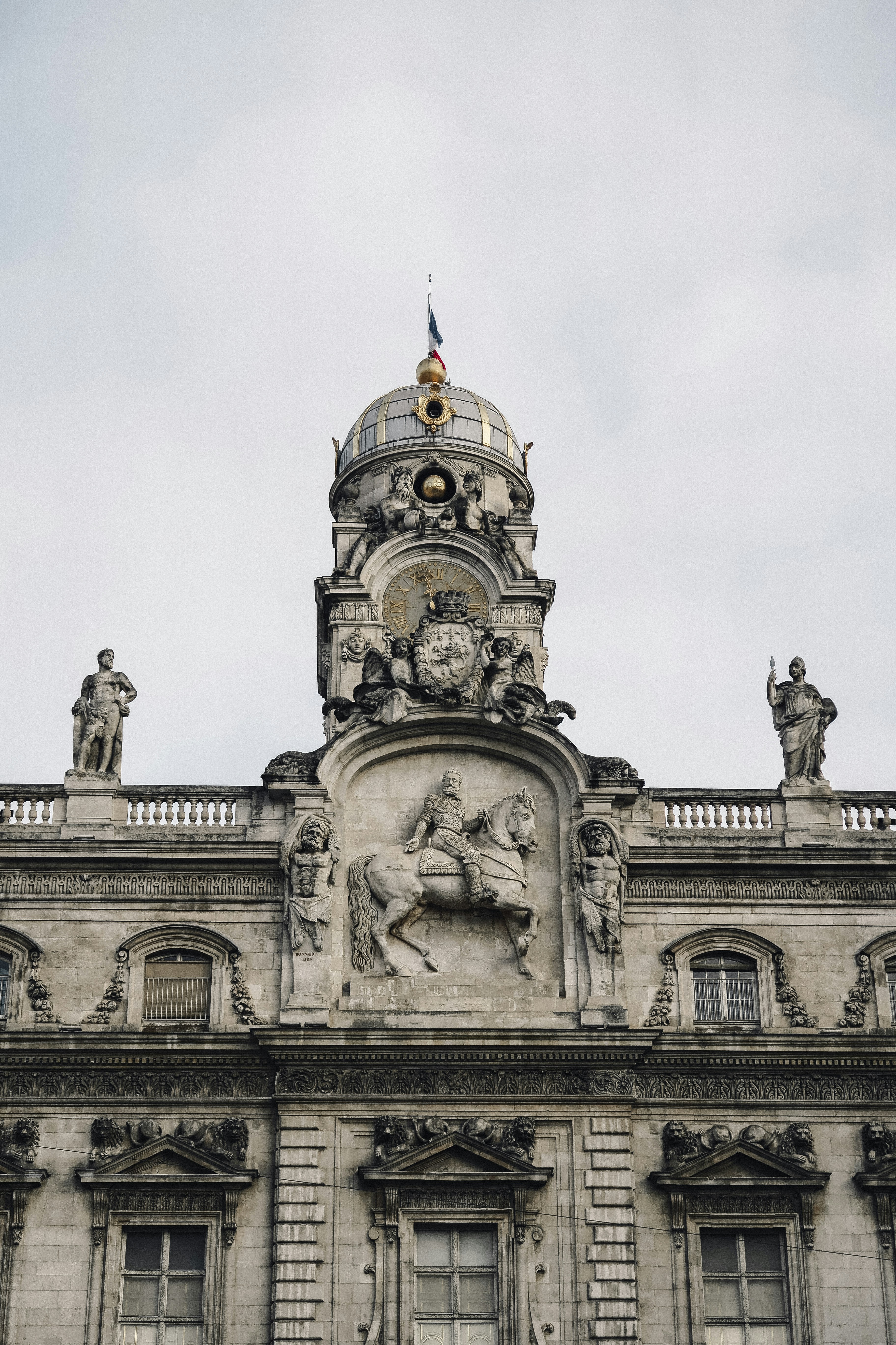 A tall building with a clock on the top of it
