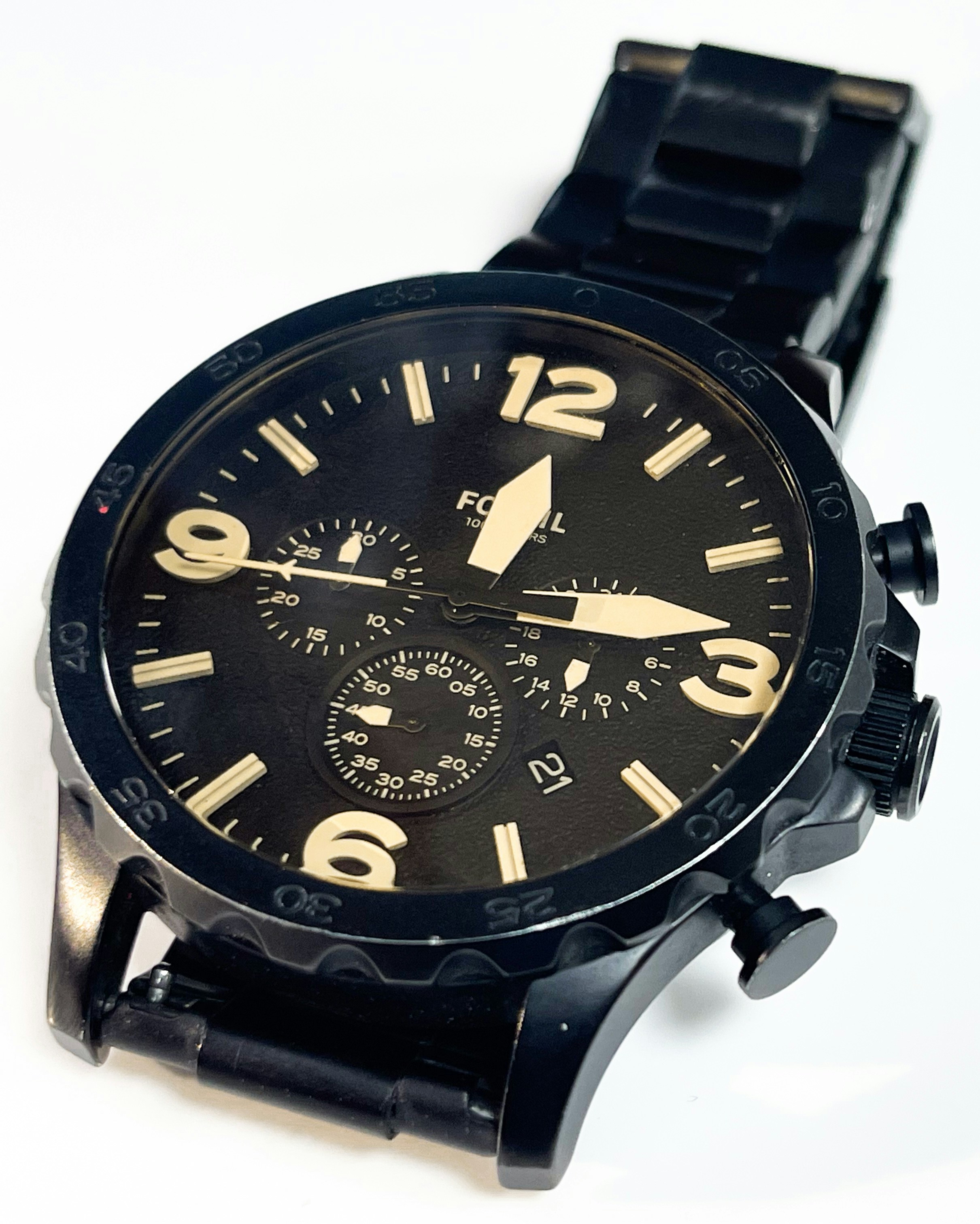 A close up of a watch on a white surface