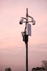 A street light with two cameras attached to it