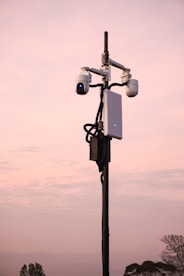 A street light with two cameras attached to it