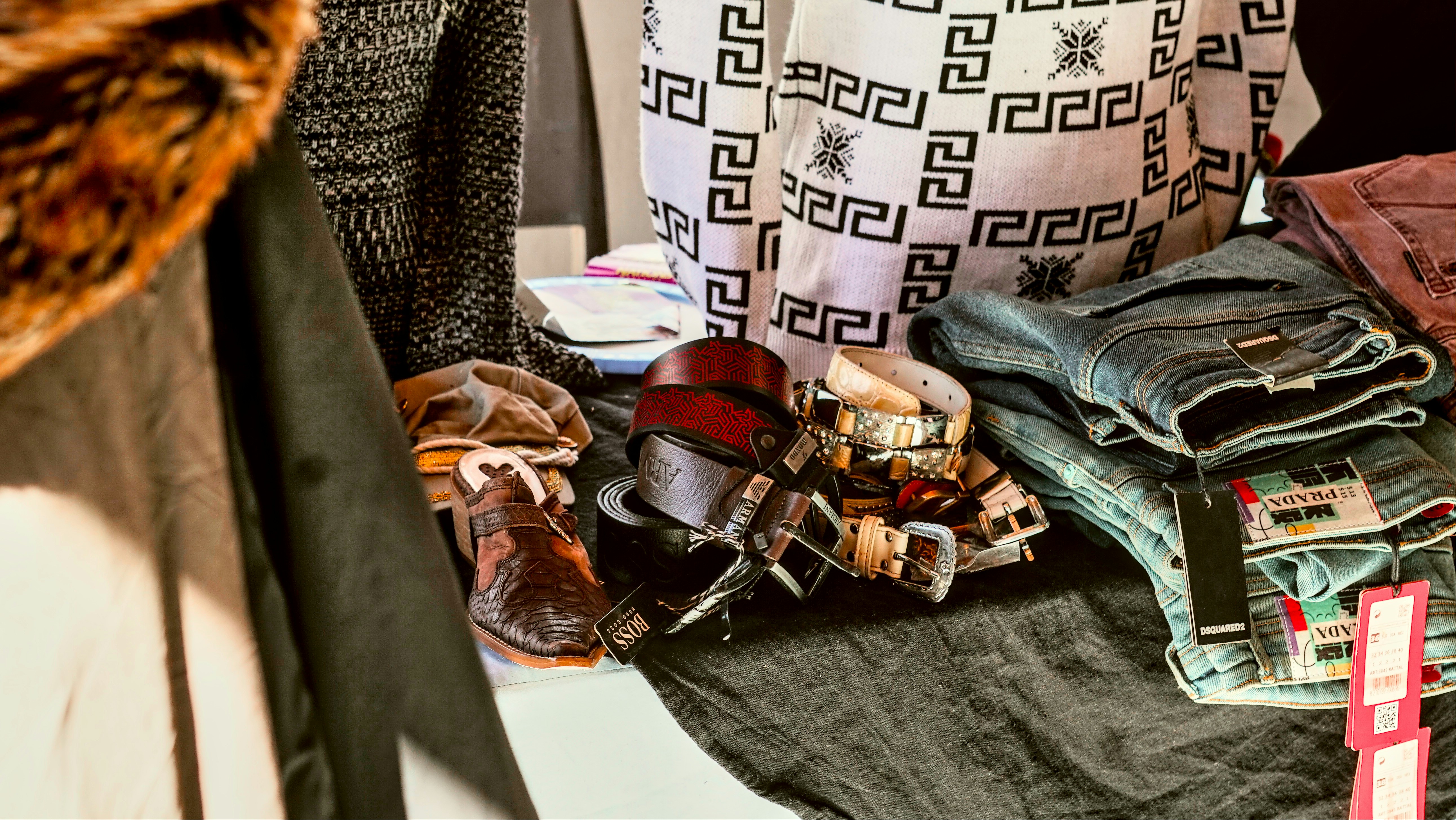A pile of clothes sitting on top of a table