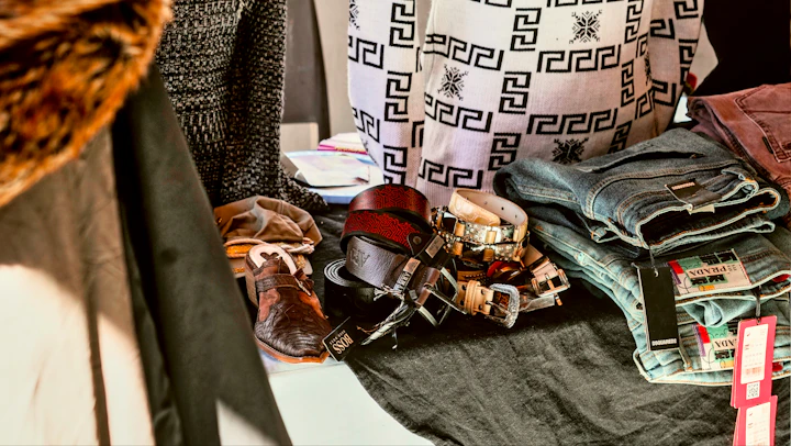A pile of clothes sitting on top of a table