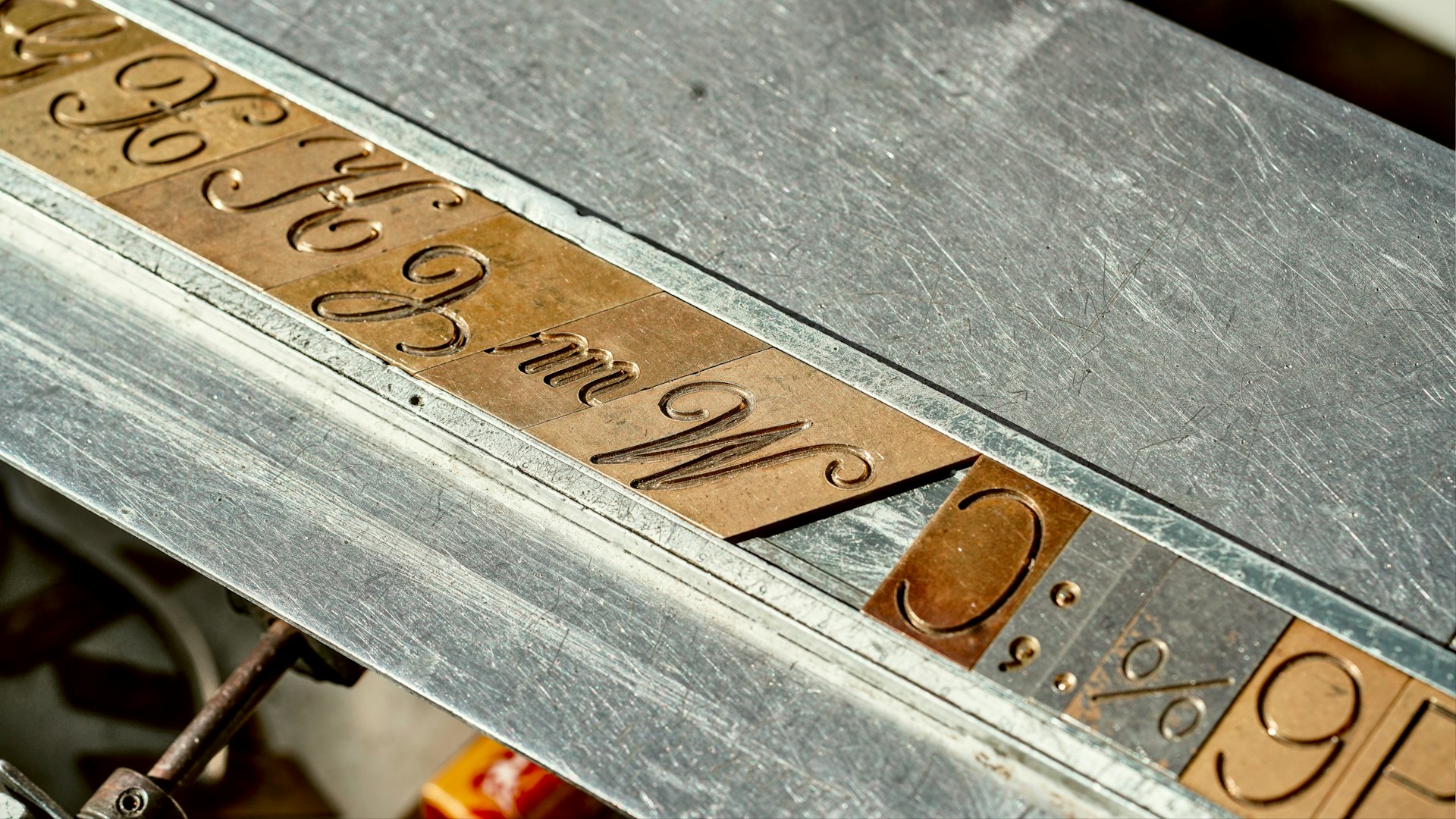 A close up of a metal table with writing on it