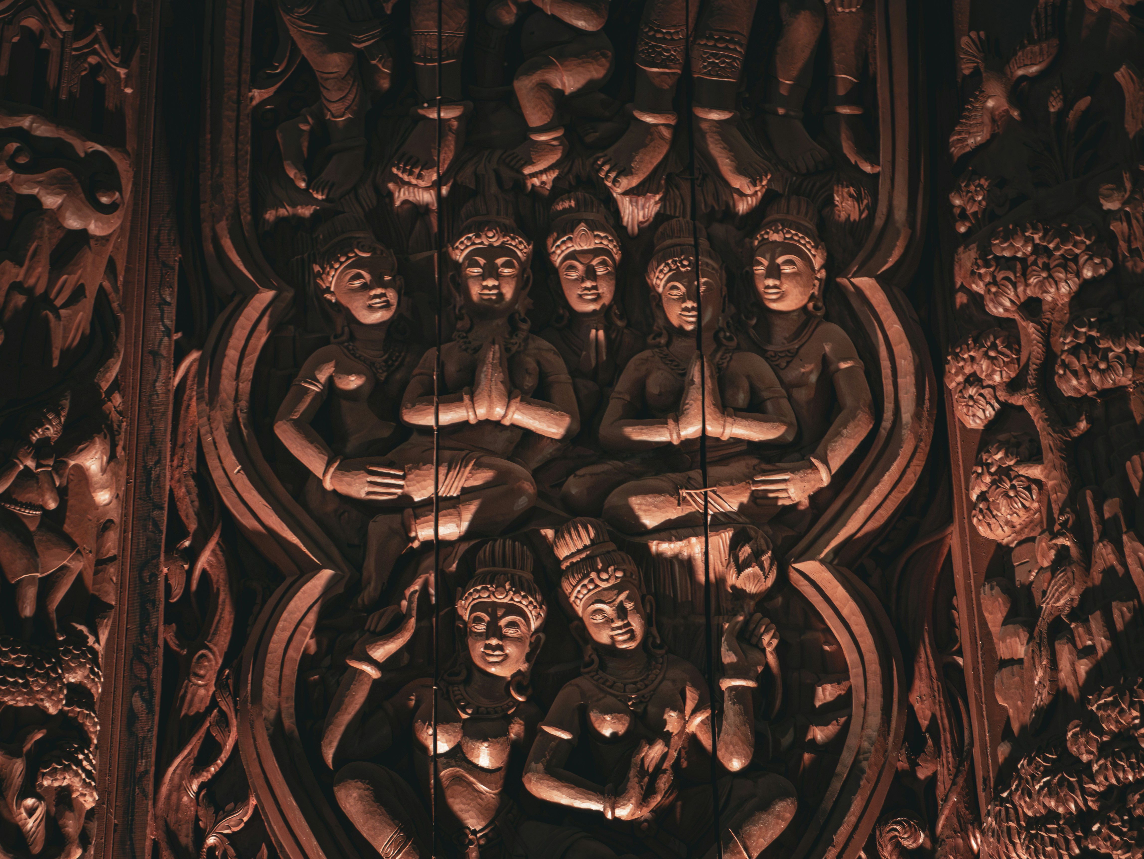 A group of people sitting on top of a wall