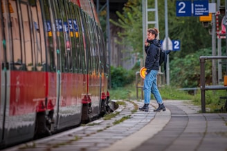 A man standing next to a train on a train track