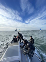 A group of people riding on the back of a boat
