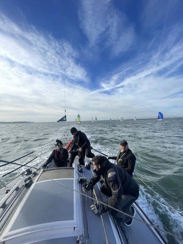 A group of people riding on the back of a boat