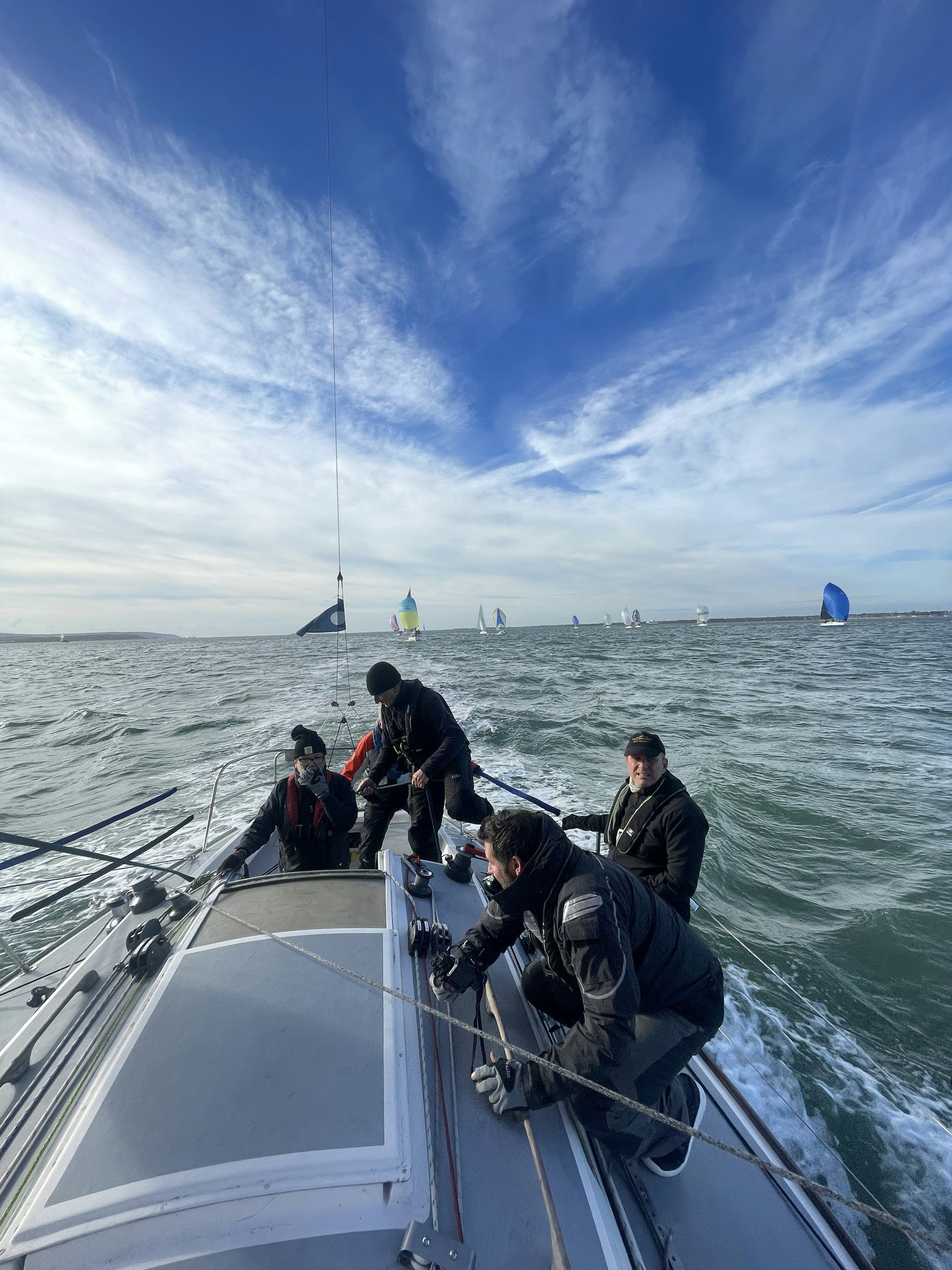 A group of people riding on the back of a boat