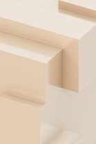 A close up of a wall with a clock on it