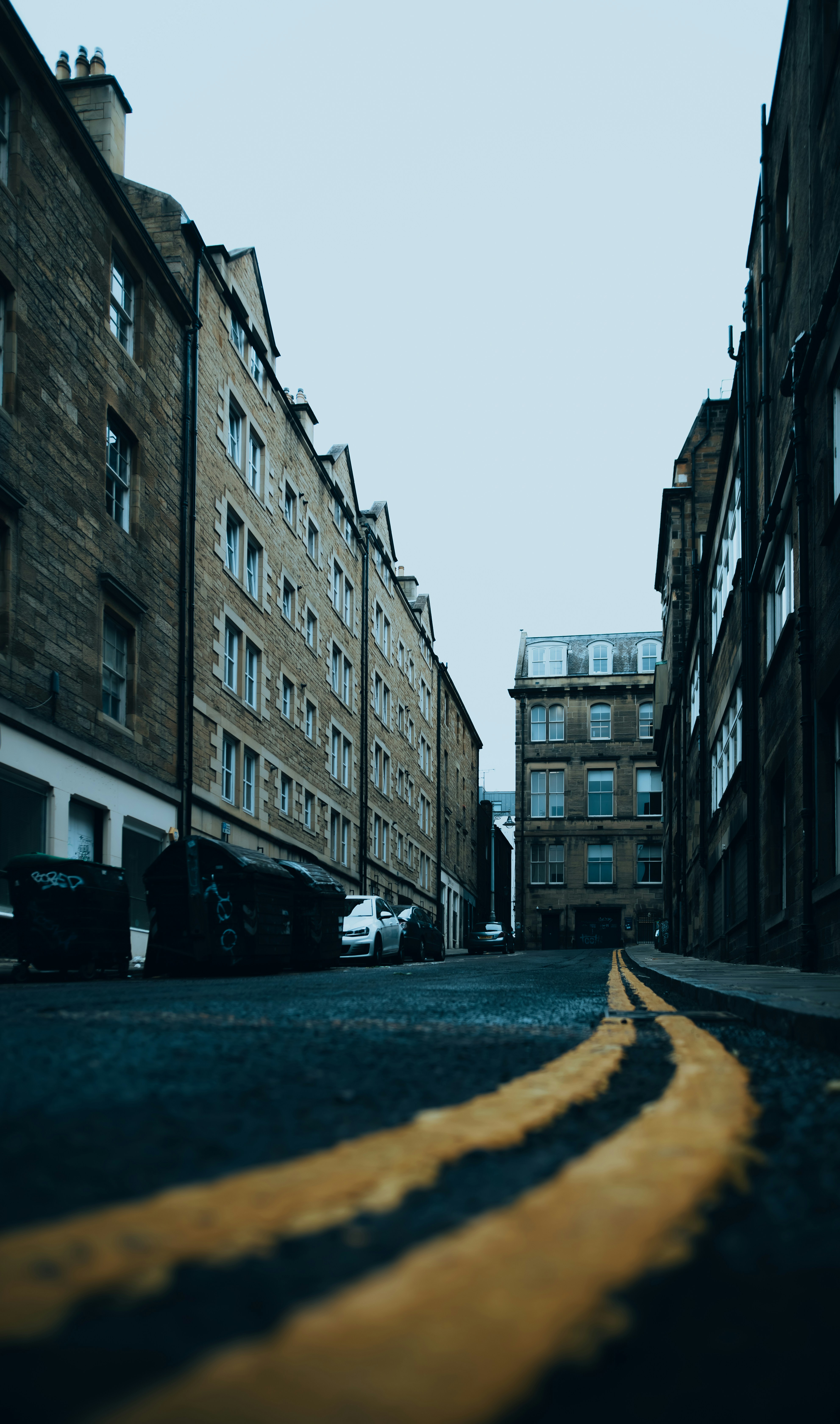 A narrow street with buildings on both sides
