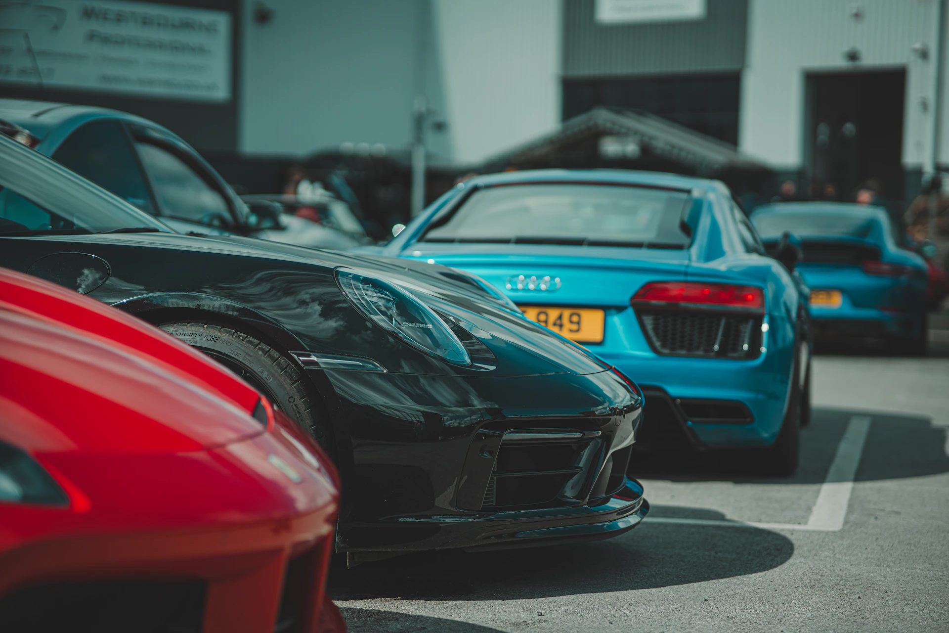 A bunch of cars parked in a parking lot