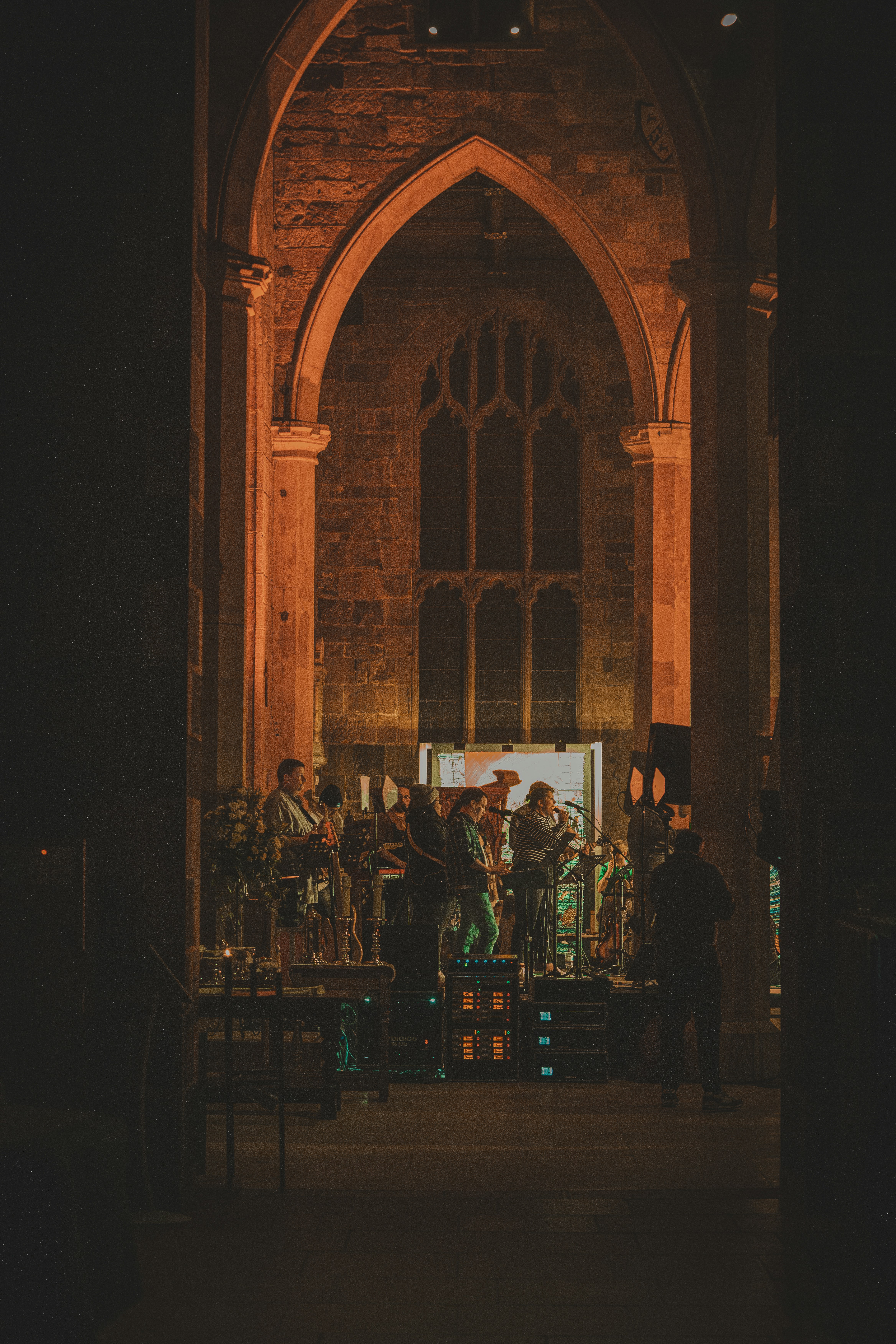 A group of people standing in front of a church