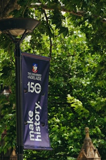 A street light with a banner hanging from it's side