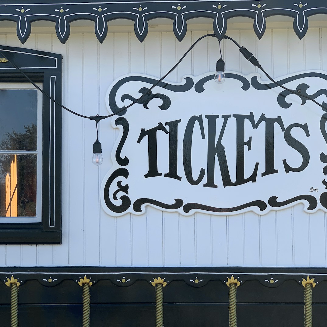 A sign on the side of a building that says tickets by Michael Hamments (@35mmtodgt)