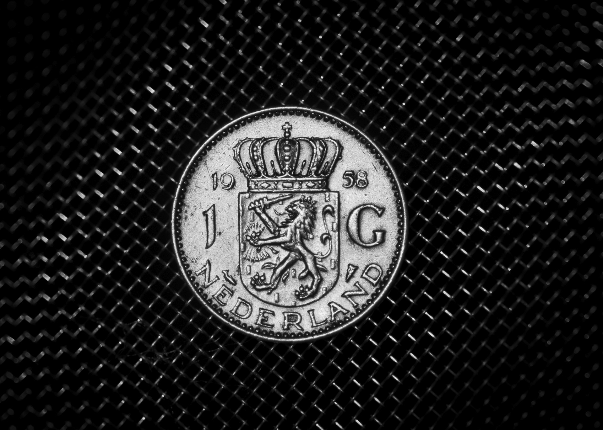 A black and white photo of a coin