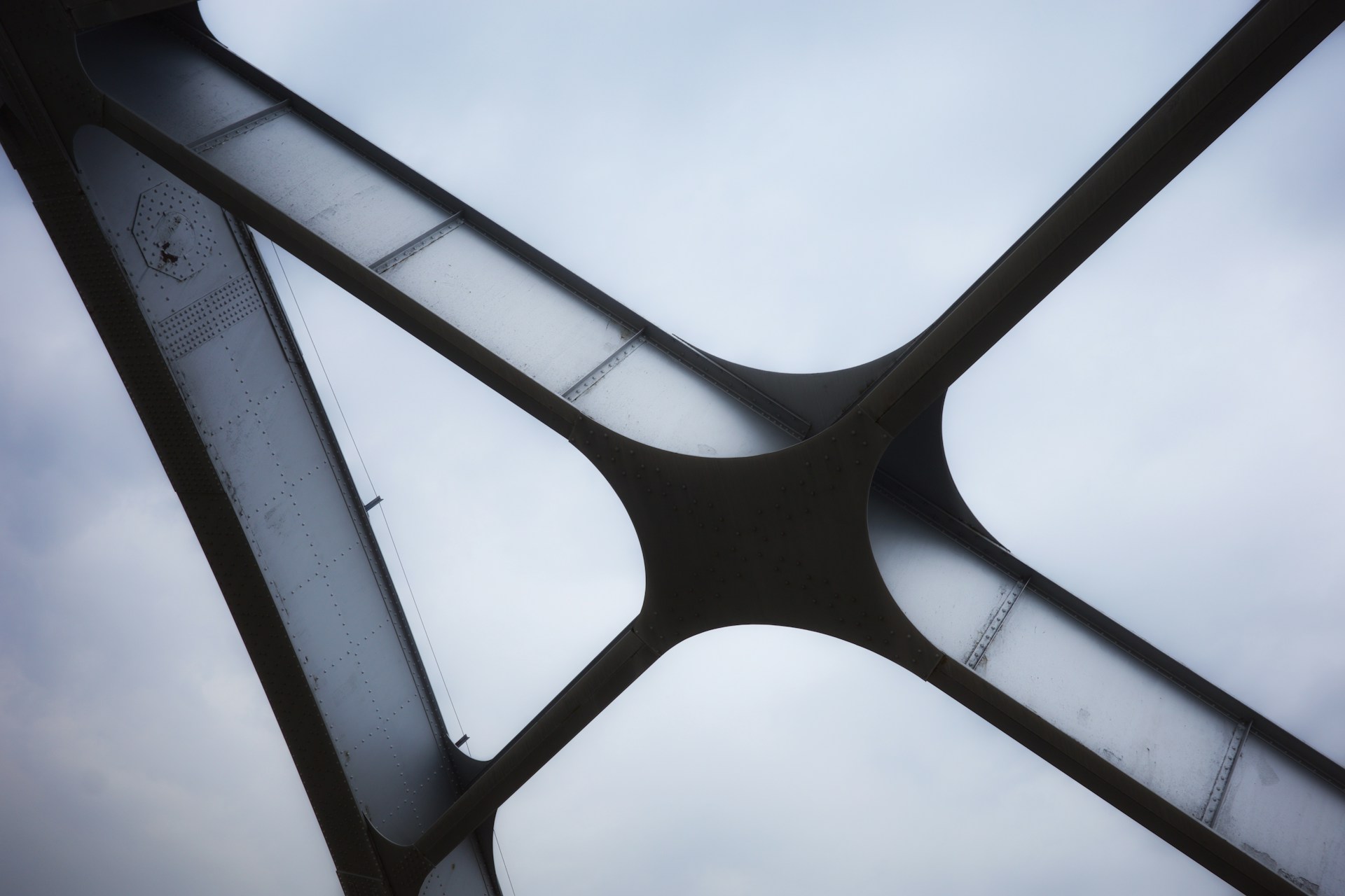 A close up of a metal structure with a sky in the background