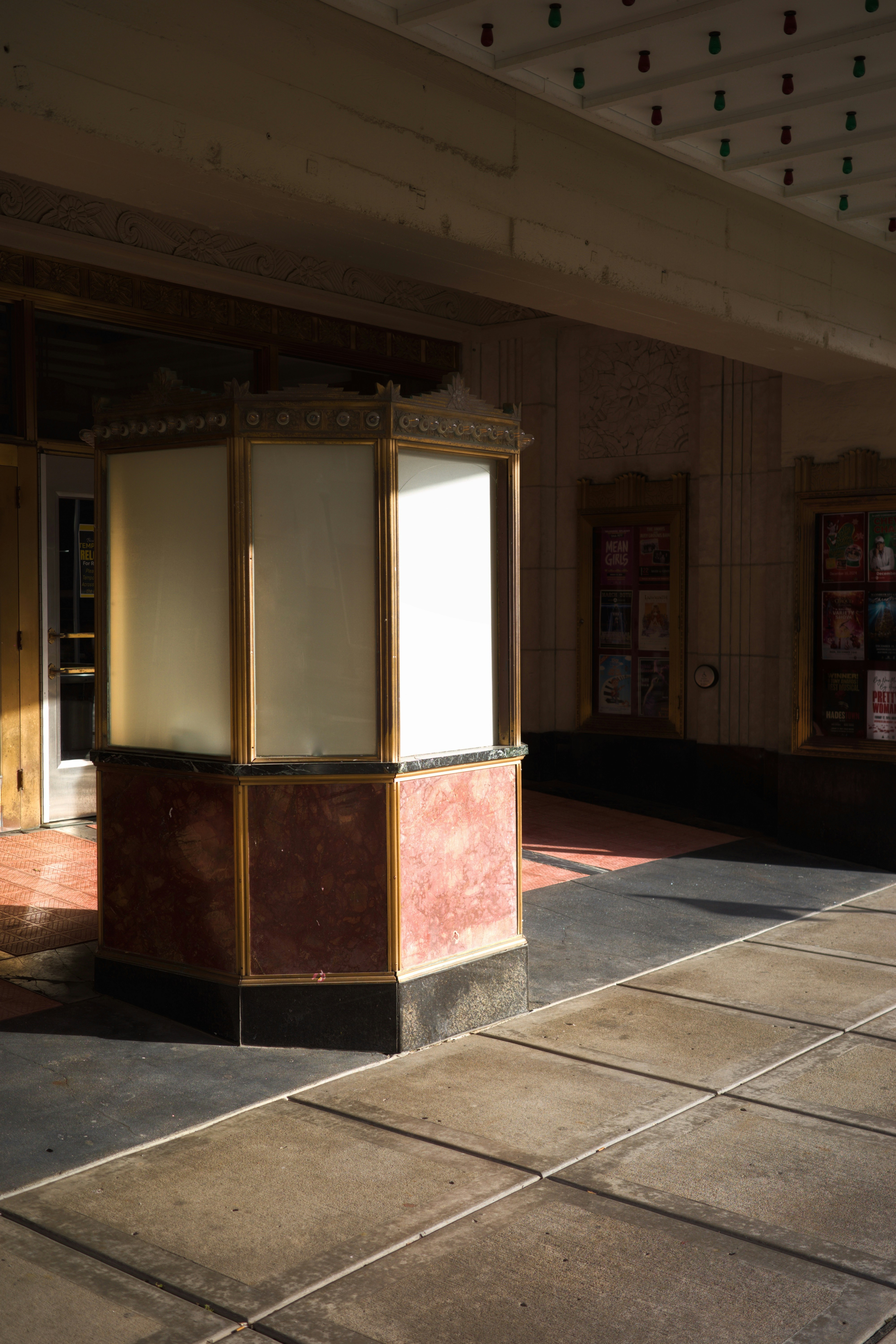 An empty room with a red and white box on the floor