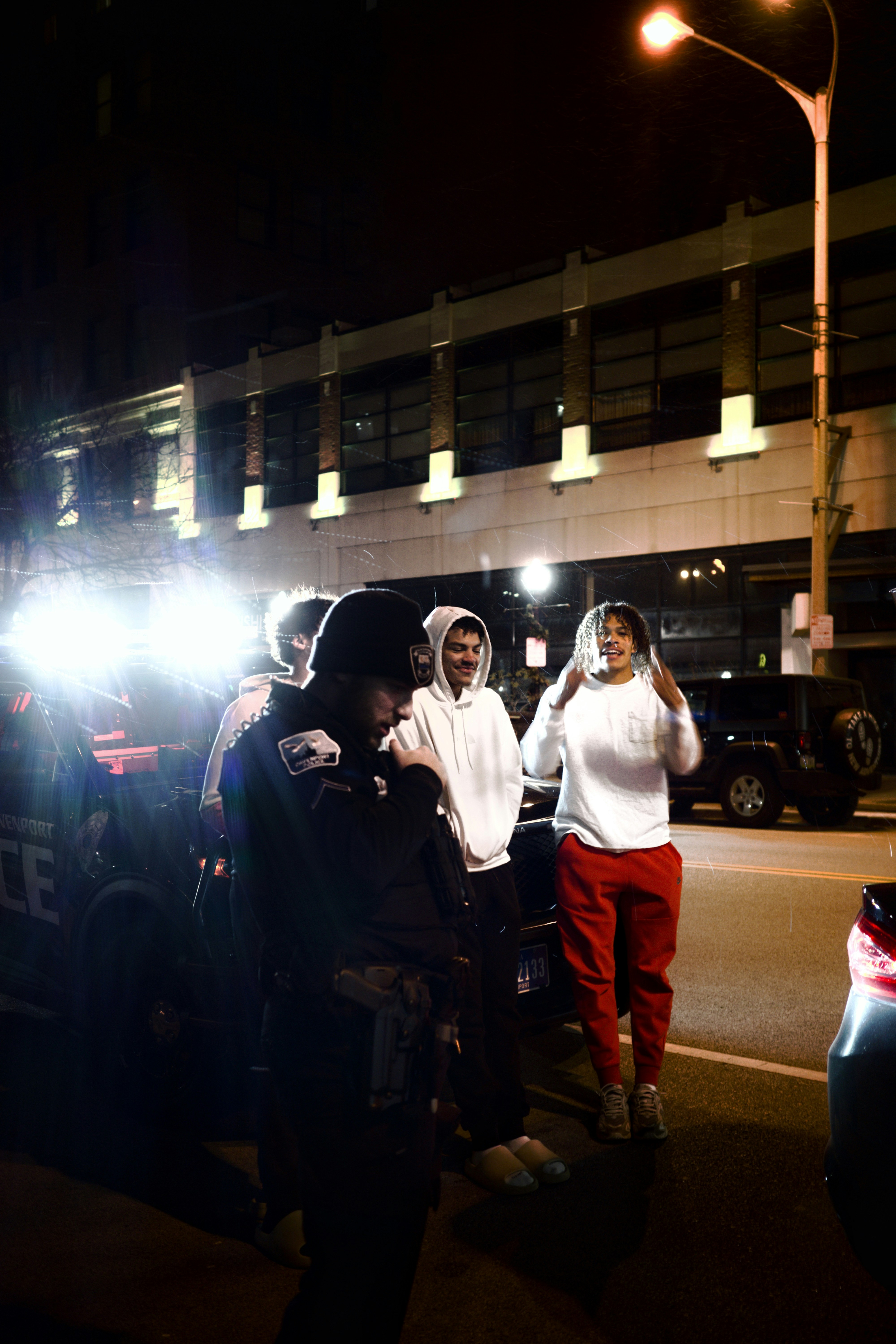 A couple of people that are standing in the street
