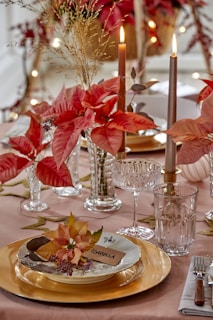 A table set for a formal dinner with candles and flowers