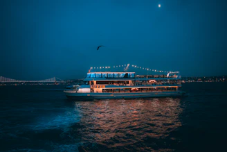 A large boat floating on top of a body of water