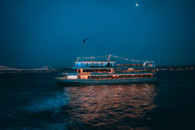 A large boat floating on top of a body of water