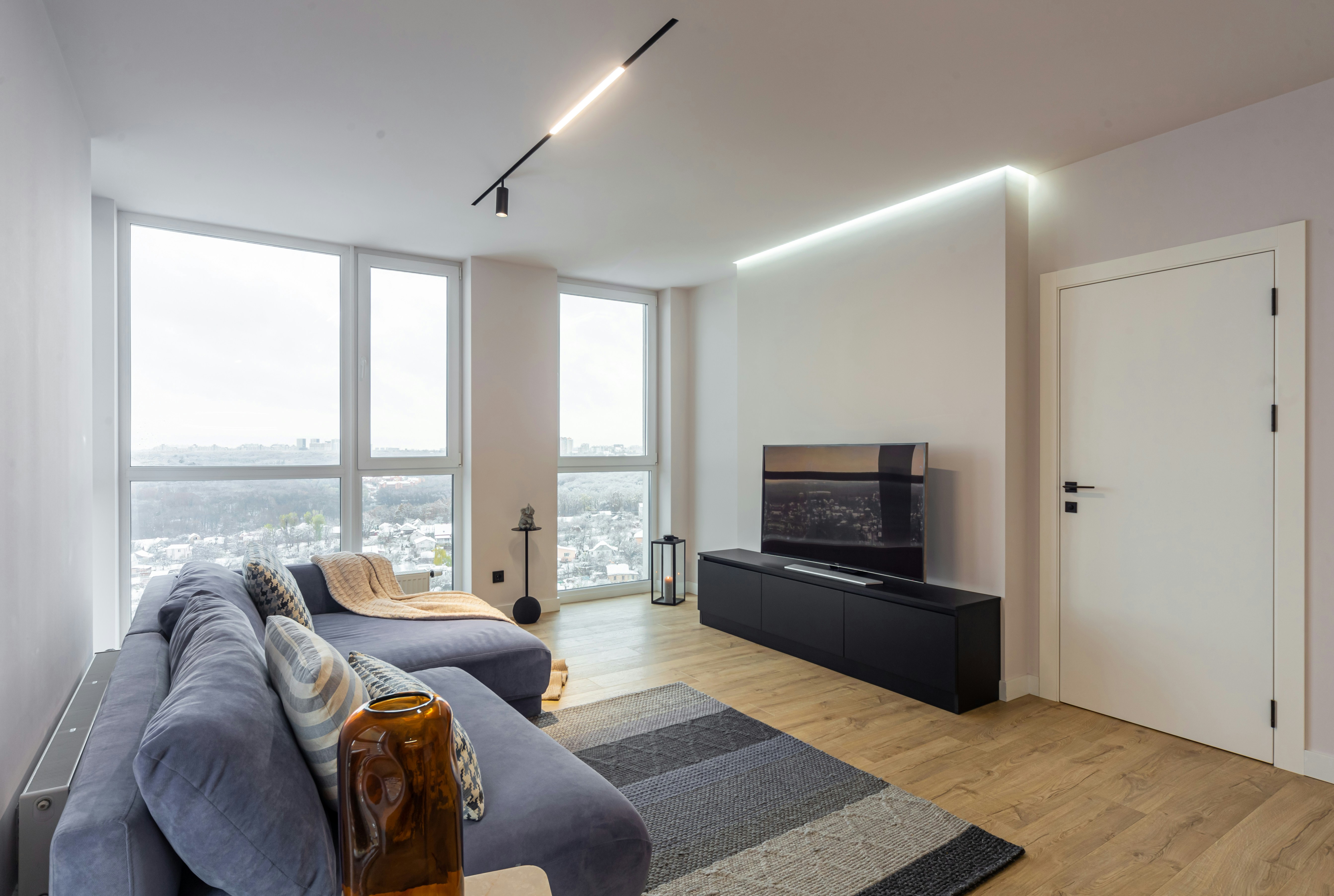 A living room filled with furniture and a flat screen TV